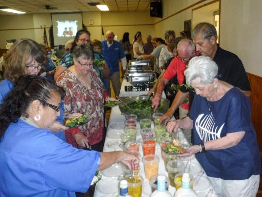 Members of Pecos County Dinner Tonight serve participants at the Healthy Cooking School.