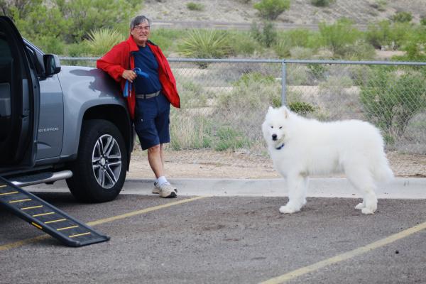 David Gonzales kept a close eye on his 85-pound companion Blue Boy at the Loves Travel stop on Monday. The fluffy white dog is a breed known as Samoyed. 