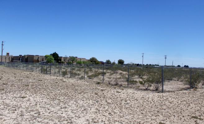 The current fenced-in vegetation, just west of the Fort Stockton Middle School campus, is considered an eye sore to many and could be replaced by a basketball pavilion if the school board decides to move in that direction. Photo by Nathan Heuer