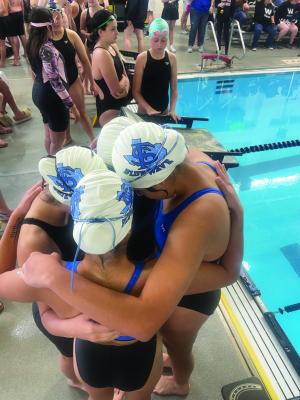 Fort Stockton Middle School’s Blue Wave girl’s relay team huddles together in preparation for their event. Courtesy photo